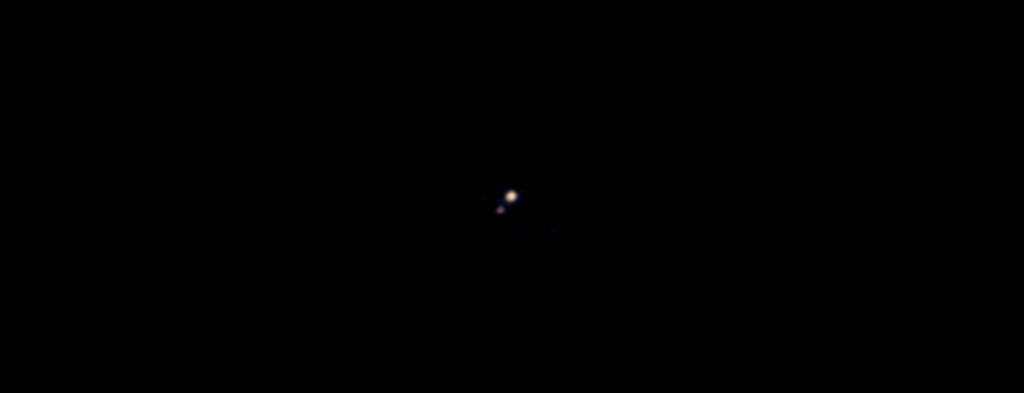 First colour image captured of the Pluto & Charon which was taken by the Ralph colour imager aboard NASA’s New Horizons spacecraft on April 9 and downlinked to Earth the following day. It is the first colour image ever made of the Pluto system by a spacecraft on approach.  (https://www.nasa.gov/content/first-pluto-charon-color-image-from-new-horizons )