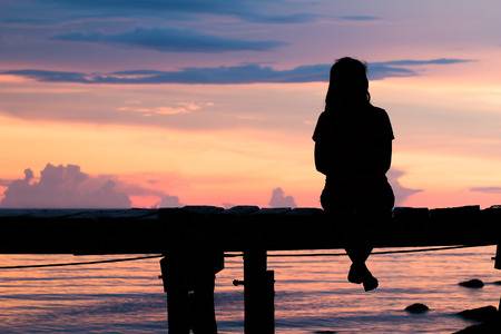 49160349-lonely-woman-sitting-on-a-wooden-bridge-sunset-style-abstract ...